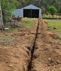 trench to run power to a shed on a farm in tamworth