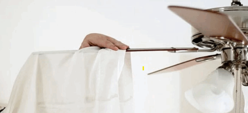 dusting ceiling fan with pillow case trick